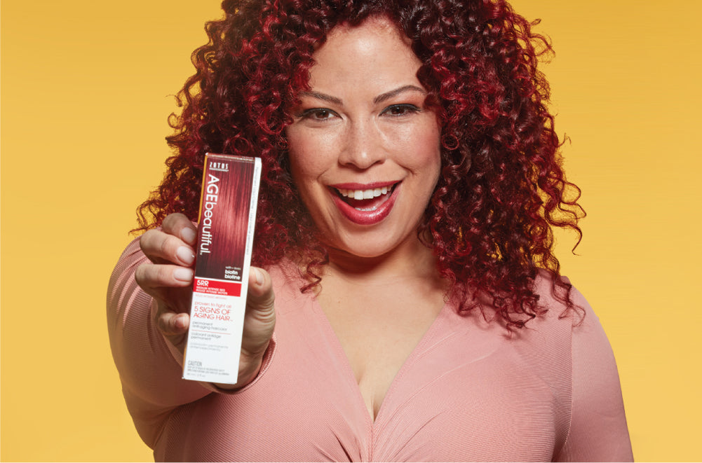 Woman with red hair and product