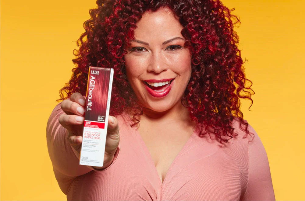 woman holding hair color box