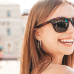 portrait smiling woman in sunglasses