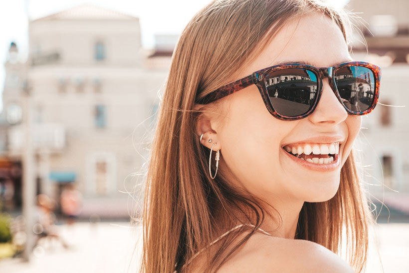portrait smiling woman in sunglasses