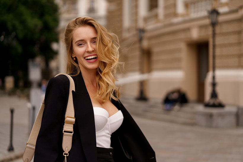 smiling woman elegant black suit