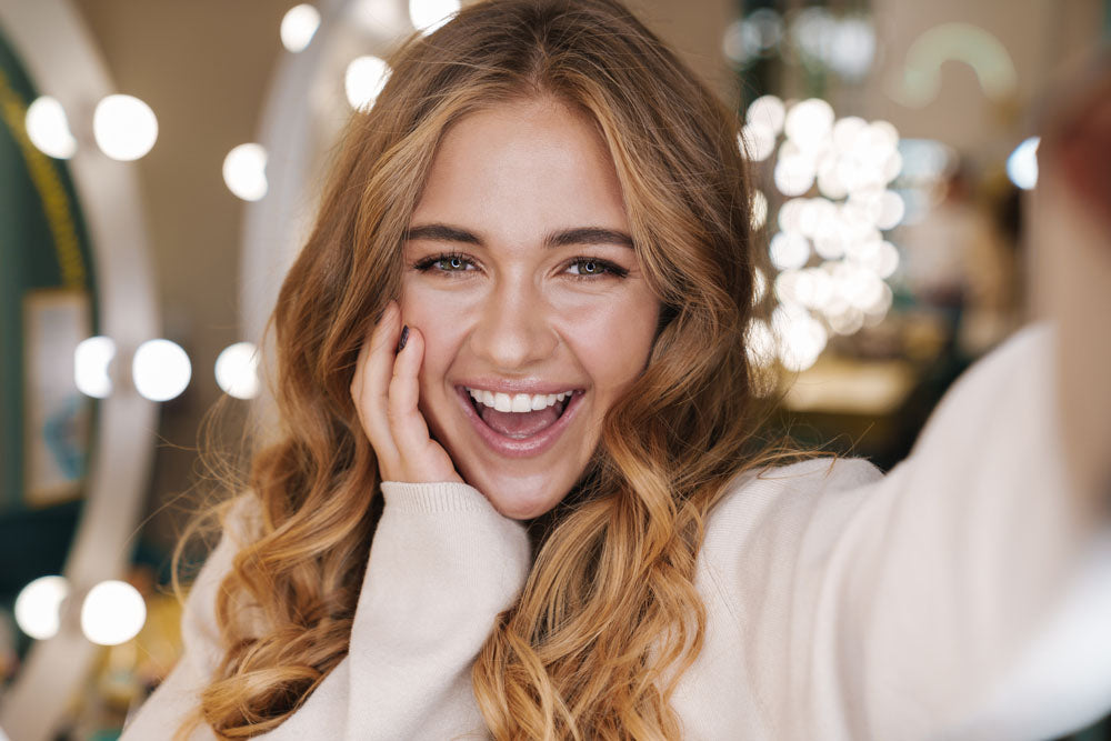 smiling woman long curly hair