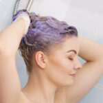 woman applying coloring shampoo