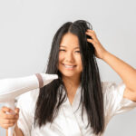 woman with hair dryer on